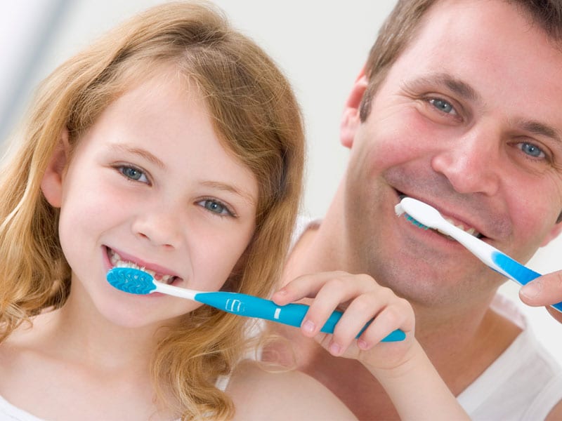 Father And Daughter Washing Teeth Johnston Dental Care Llc 