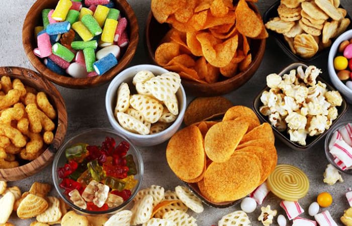 constant-snacking Numerous bowls of snacks and junkfood